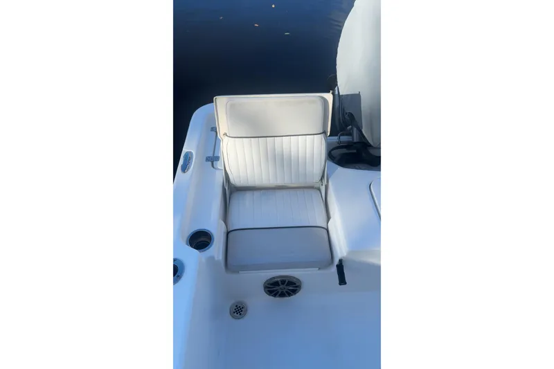 Slide: The Image of 2019 Sea Fox 200 Viper boat seat with white upholstery and cup holders. - 13