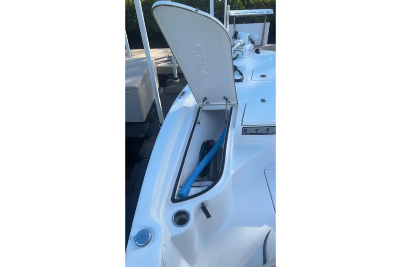 Slide: The Image of 2019 Sea Fox 200 Viper boat with open storage compartment and visible blue hose. - 4