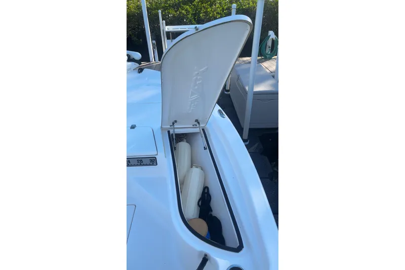 Slide: The Image of Open storage compartment on a 2019 Sea Fox 200 Viper boat, showing fenders and equipment. - 5