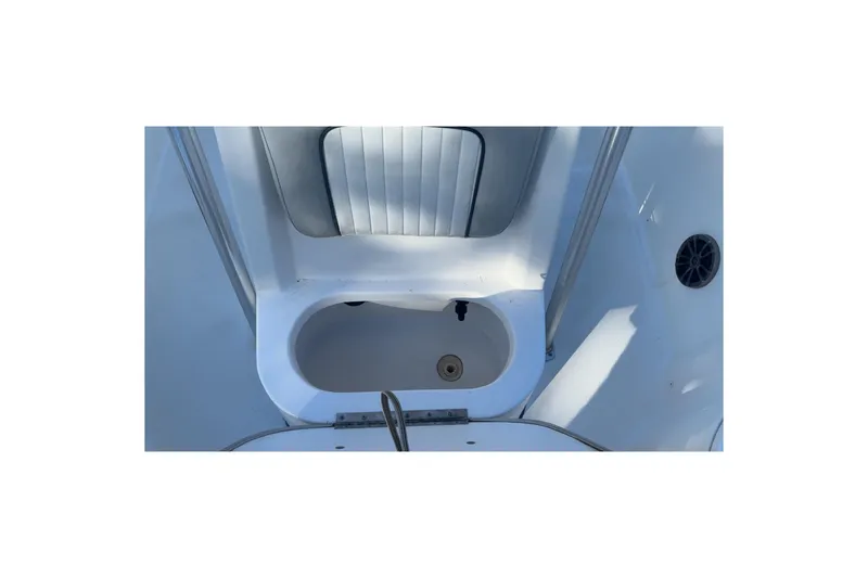 Slide: The Image of 2019 Sea Fox 200 Viper boat interior, featuring a white seating area and storage compartment. - 7