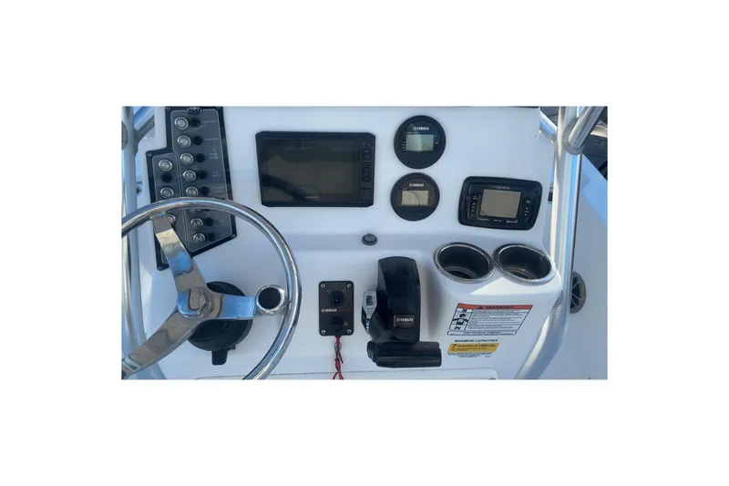 Slide: The Image of 2019 Sea Fox 200 Viper boat dashboard with steering wheel and electronic controls. - 9