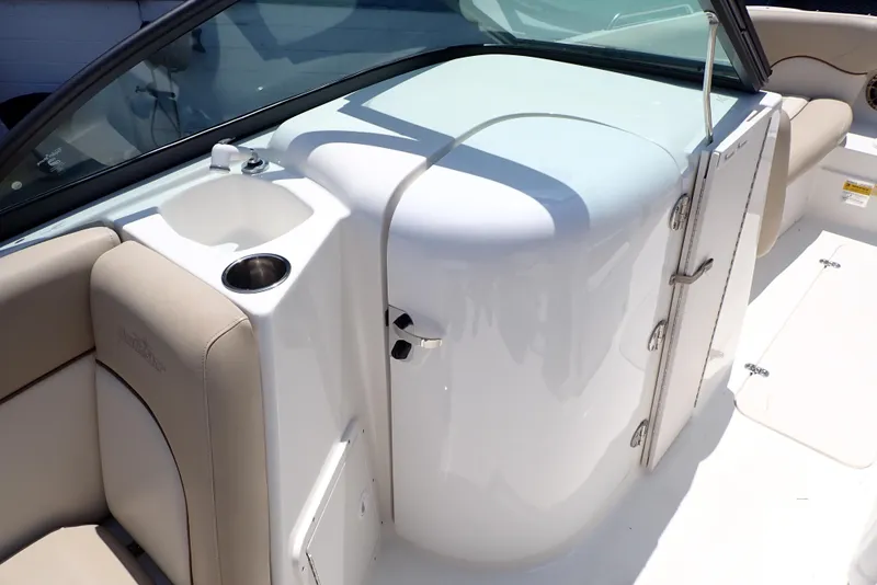 Slide: The Image of 2021 NauticStar 223 DC boat interior with seating and storage compartment. - 10