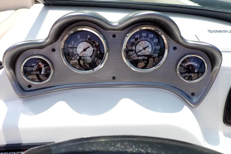 Slide: The Image of Dashboard of 2021 NauticStar 223 DC boat with RPM, MPH, and fuel gauges. - 16