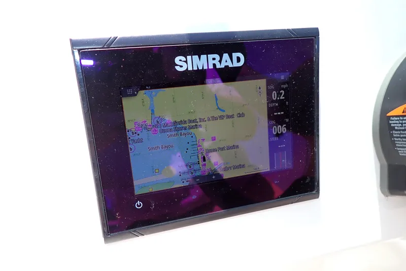 Slide: The Image of Simrad navigation display on 2021 NauticStar 223 DC boat dashboard. - 17