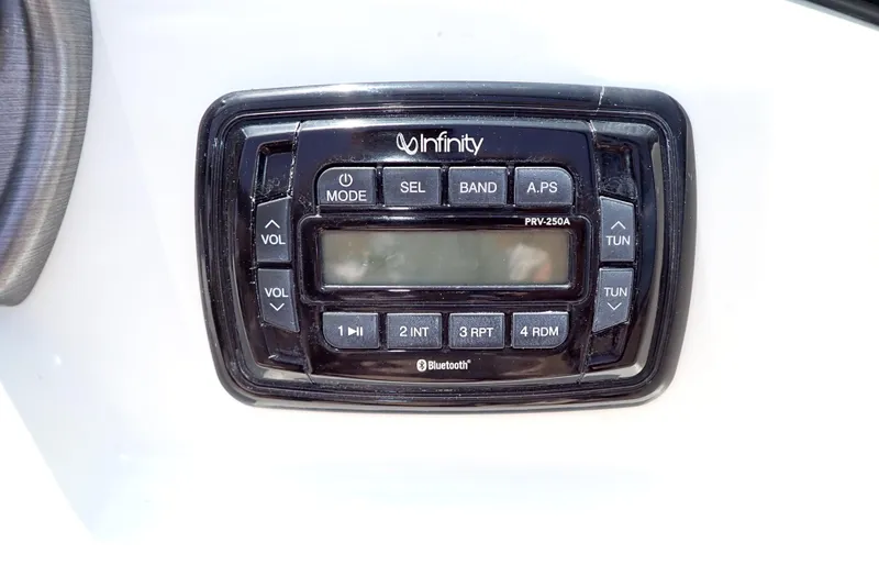 Slide: The Image of Infinity stereo system on 2021 NauticStar 223 DC boat dashboard. - 18