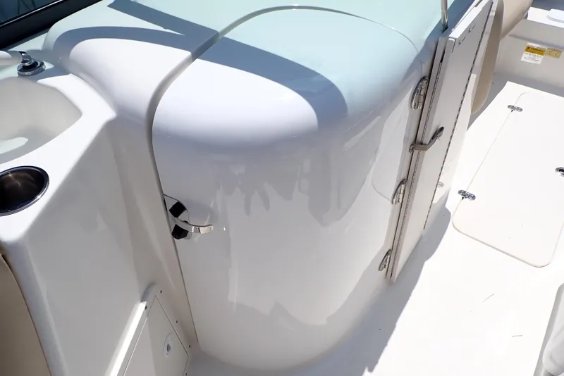 Slide: The Image of 2021 NauticStar 223 DC boat interior, featuring sleek white design and modern amenities. - 35