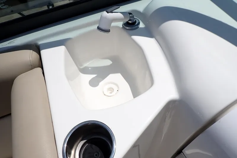 Slide: The Image of 2021 NauticStar 223 DC boat sink and cup holder on deck. - 39