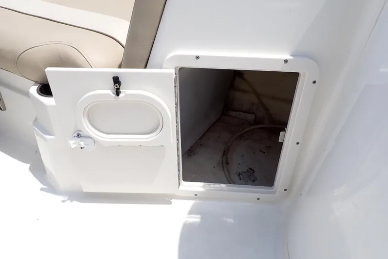 Slide: The Image of Open storage compartment on 2021 NauticStar 223 DC boat interior. - 41