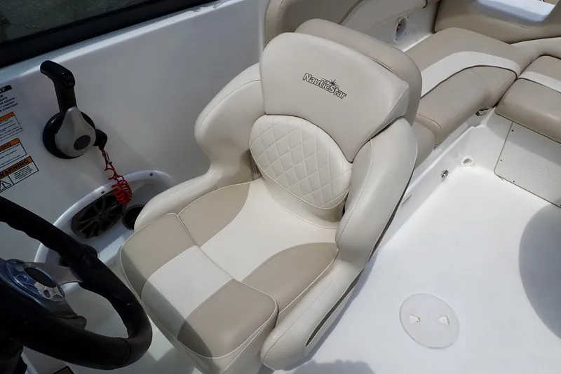 Slide: The Image of 2021 NauticStar 223 DC boat seat with beige and white upholstery. - 43