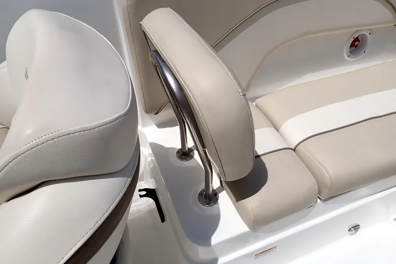 Slide: The Image of 2021 NauticStar 223 DC boat interior with beige and white seating. - 44