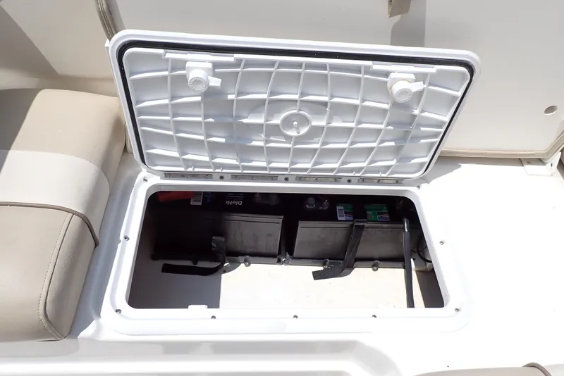 Slide: The Image of Open storage compartment on 2021 NauticStar 223 DC boat, revealing interior space. - 47