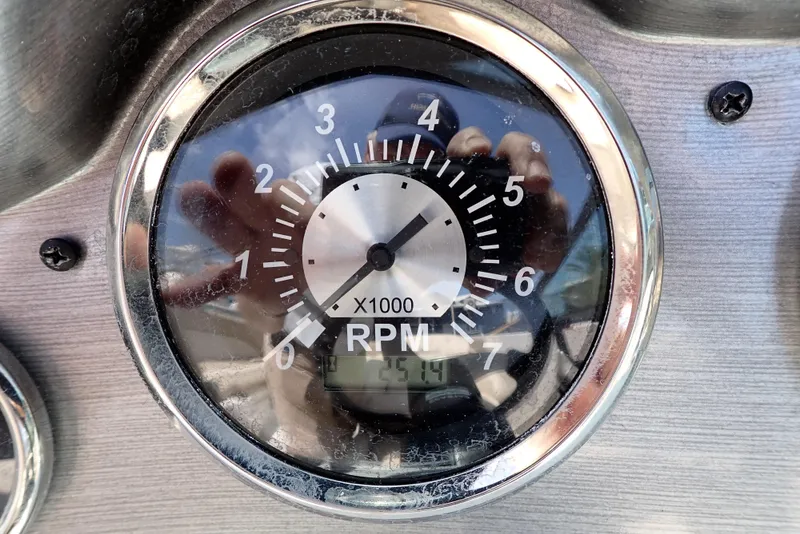 Slide: The Image of Tachometer of 2021 NauticStar 223 DC showing RPM with reflection. - 5