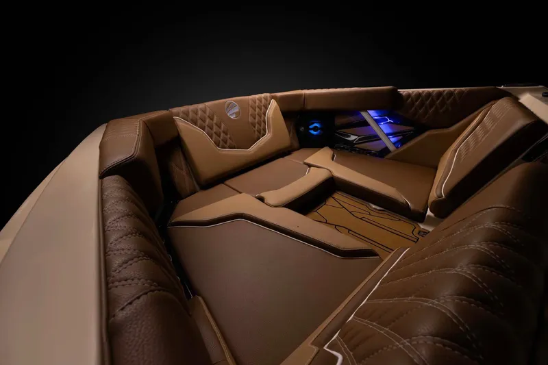 Slide: The Image of Manufacturer Provided Image: Luxurious interior of 2026 Tigé 22RZX boat with brown leather seating and ambient lighting. - 3