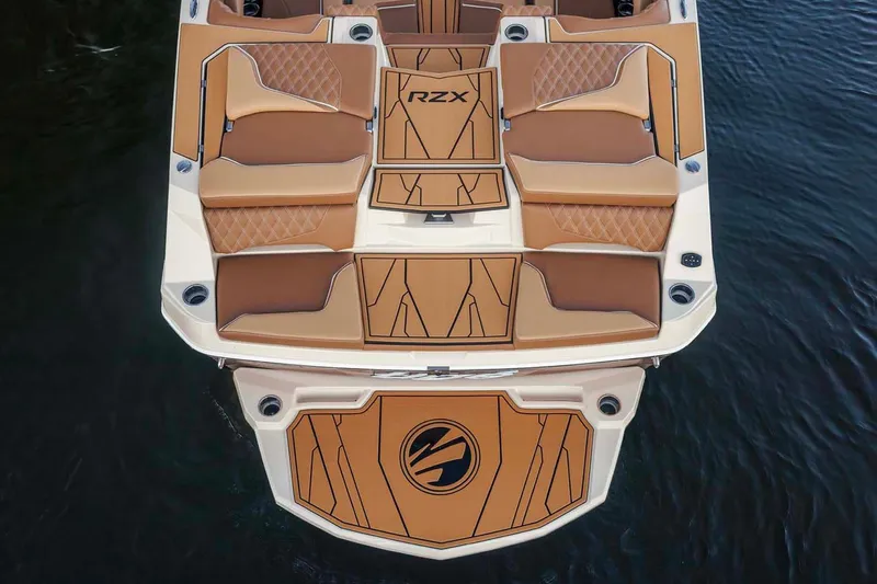 Slide: The Image of Manufacturer Provided Image: 2026 Tigé 22RZX boat with luxurious tan seating and sleek design on the water. - 7