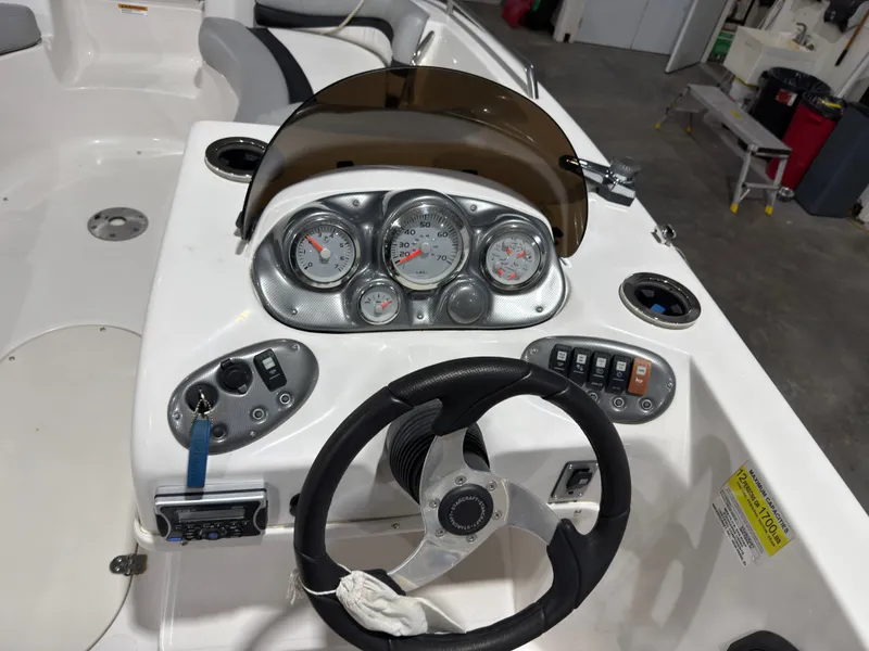 Slide: The Image of Dashboard of a 2014 Starcraft 2000 Limited boat. - 11