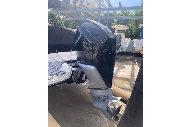 Slide: The Image of 2020 Sea Ray SDX 270 Outboard with Mercury Verado engine in a marina setting. - 11