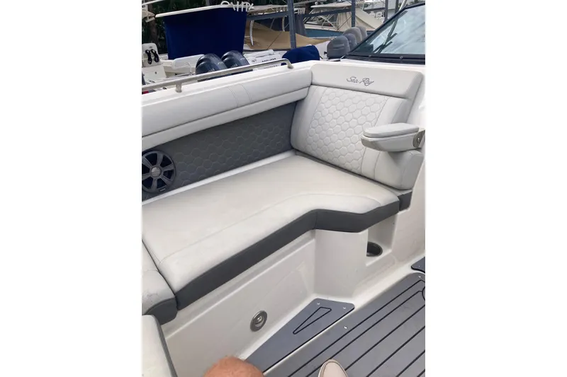 Slide: The Image of 2020 Sea Ray SDX 270 Outboard boat interior with cushioned seating and speaker. - 15
