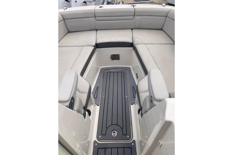 Slide: The Image of 2020 Sea Ray SDX 270 Outboard boat interior with spacious seating and sleek flooring. - 17