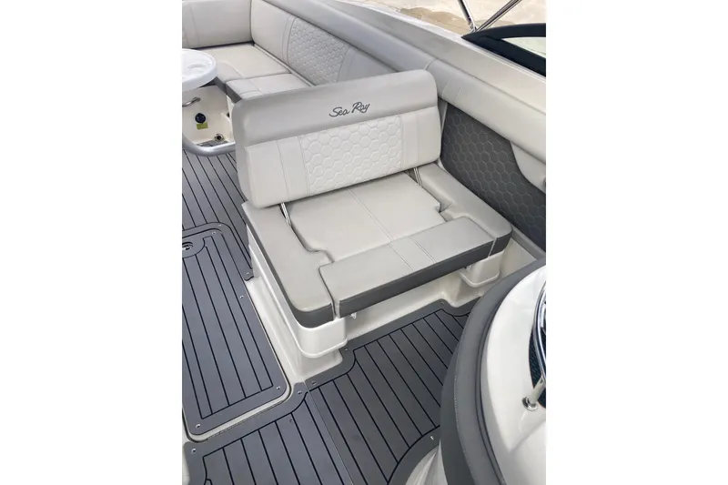 Slide: The Image of 2020 Sea Ray SDX 270 Outboard boat interior with gray seating and flooring. - 19