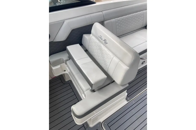 Slide: The Image of 2020 Sea Ray SDX 270 Outboard boat seating with gray upholstery and hexagonal pattern. - 20