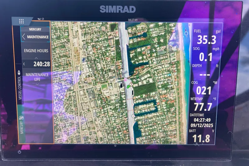 Slide: The Image of Simrad navigation display on 2020 Sea Ray SDX 270 Outboard, showing map and vessel data. - 22
