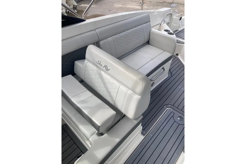 Slide: The Image of 2020 Sea Ray SDX 270 Outboard boat interior with gray seating and deck. - 25
