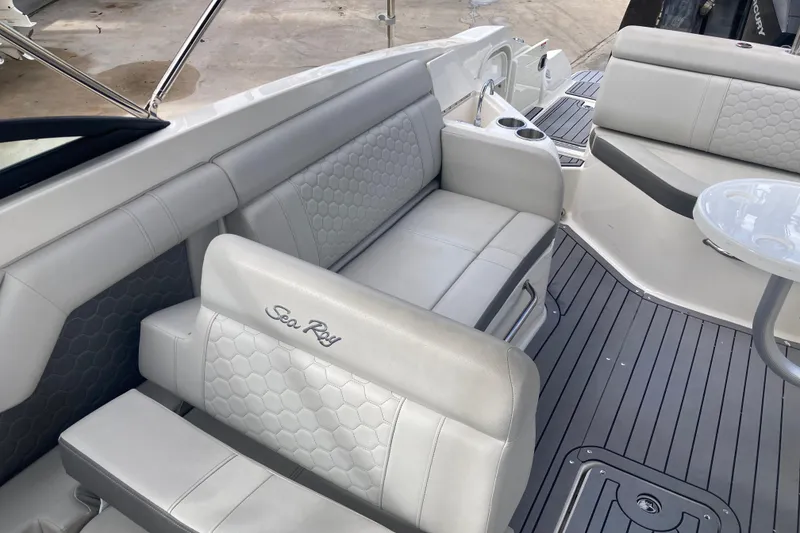 Slide: The Image of 2020 Sea Ray SDX 270 Outboard interior with gray seating and hexagonal pattern. - 27