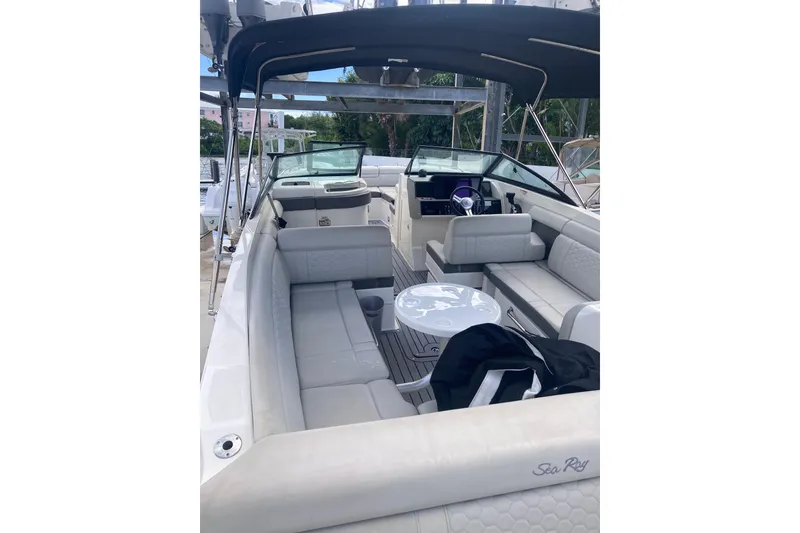 Slide: The Image of 2020 Sea Ray SDX 270 Outboard boat interior with seating and table. - 33