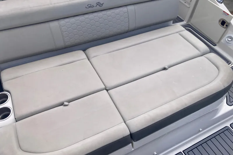 Slide: The Image of 2020 Sea Ray SDX 270 Outboard boat seating with cup holders and cushioned backrest. - 34