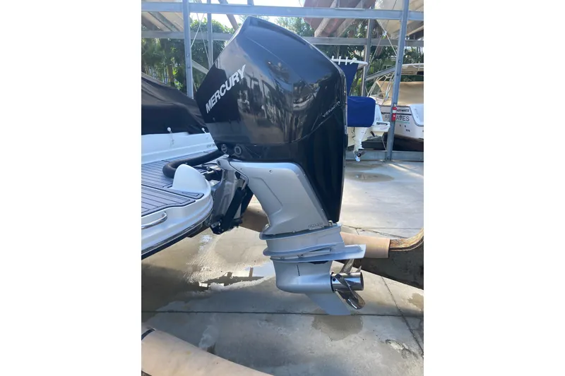 Slide: The Image of 2020 Sea Ray SDX 270 Outboard with Mercury engine in a marina setting. - 35