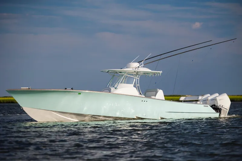 Slide: The Image of Compact boat bathroom with sink, toilet, and control panel in 2018 Tribute 37 model. - 5