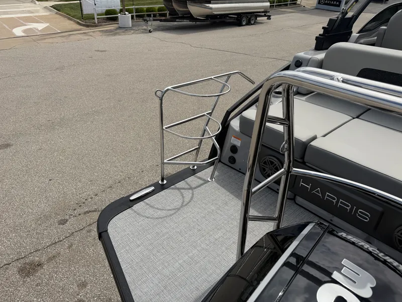 Slide: The Image of Harris Solstice DC 250 boat, 2026 model, parked on pavement. - 11