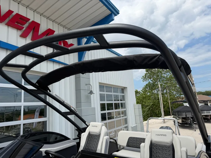 Slide: The Image of Harris Solstice DC 250 boat, 2026 model, displayed outdoors. - 15