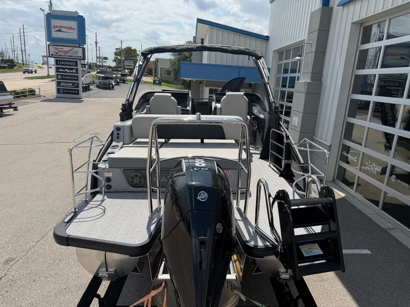 Slide: The Image of Harris Solstice DC 250 boat, 2026 model, parked outside dealership. - 3