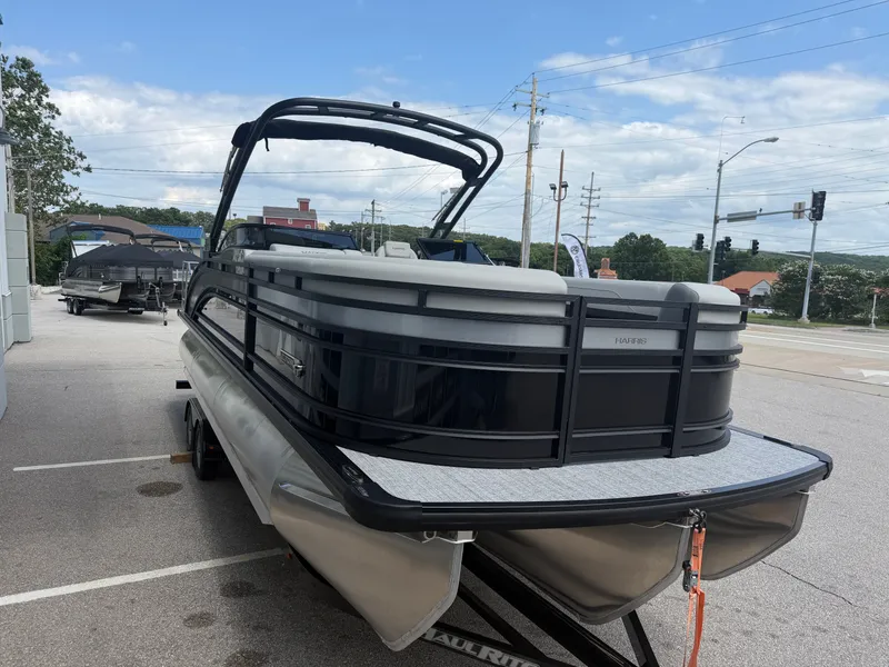 Slide: The Image of 2026 Harris Solstice DC 250 pontoon boat on a trailer. - 6