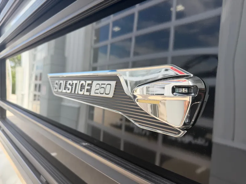 Slide: The Image of Close-up of Harris Solstice DC 250 emblem, 2026 model. - 8