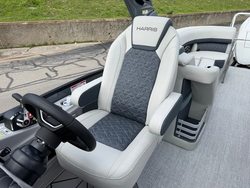 Slide: The Image of Interior of 2026 Harris Grand Mariner 270 with luxurious captain's chair. - 18