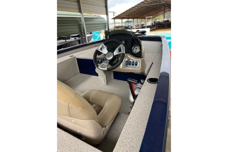 The Image of 2025 G3 Sportsman 1610 boat interior with steering wheel and control panel. - 1