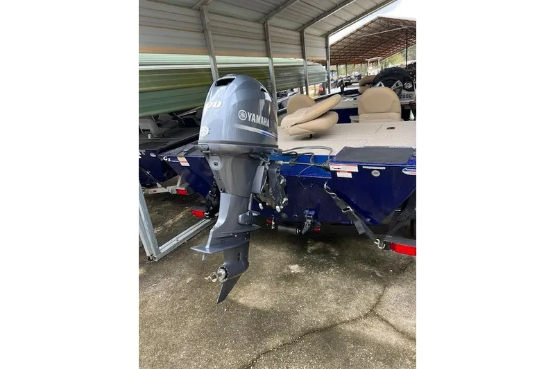 Slide: The Image of 2025 G3 Sportsman 1610 boat with Yamaha outboard motor in covered storage. - 4