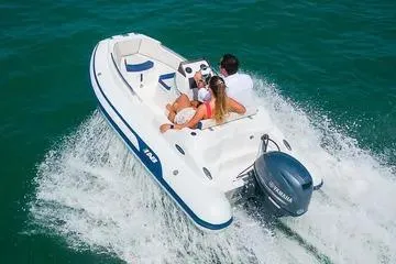 Slide: The Image of 2024 AB Inflatables Nautilus 12 DLX with Yamaha 50HP cruising on open water. - 10