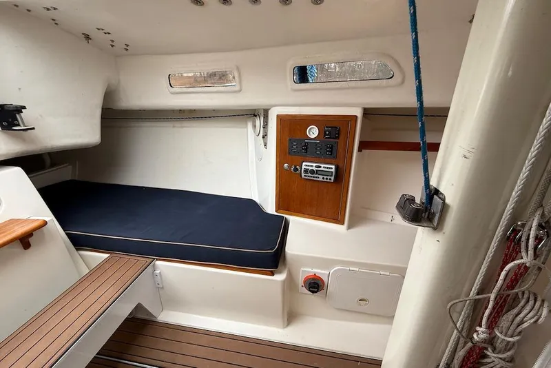 Slide: The Image of Interior of 2008 e Sailing Yachts e33, featuring a cozy cabin with control panel. - 15