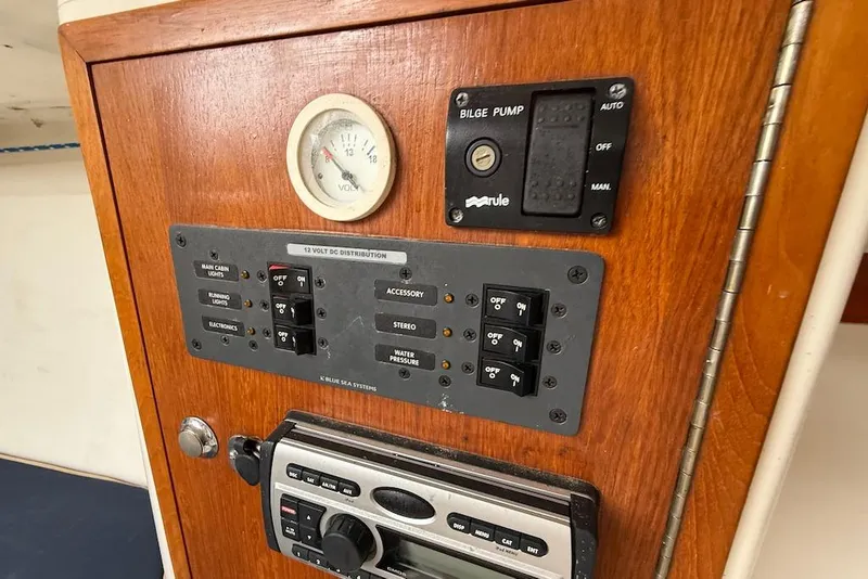Slide: The Image of Control panel of 2008 e Sailing Yachts e33 with switches and gauge. - 21
