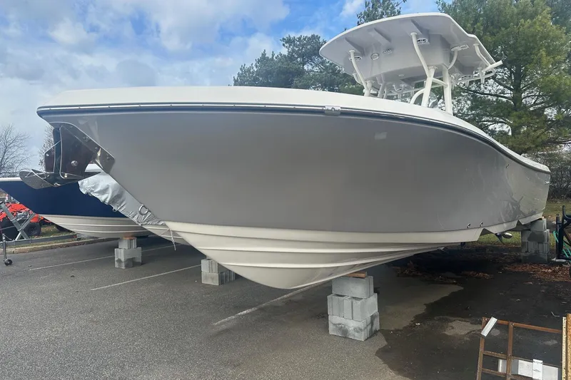 The Image of 2023 Sea Born LX26 Center Console boat with Yamaha engine on display. - 0