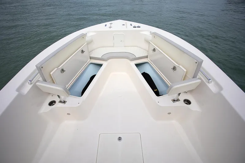 Slide: The Image of 2023 Sea Born LX26 Center Console with twin 200 horsepower engines, docked and covered. - 2