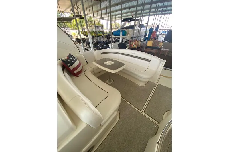 Slide: The Image of Luxurious 2006 Sea Ray 40 Sundancer yacht interior with plush seating and table. - 12