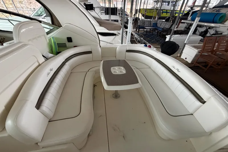 Slide: The Image of 2006 Sea Ray 40 Sundancer interior with white seating and table. - 14