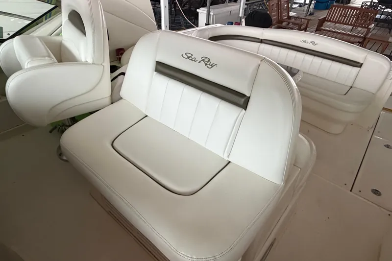 Slide: The Image of Luxurious white seating on a 2006 Sea Ray 40 Sundancer yacht. - 16