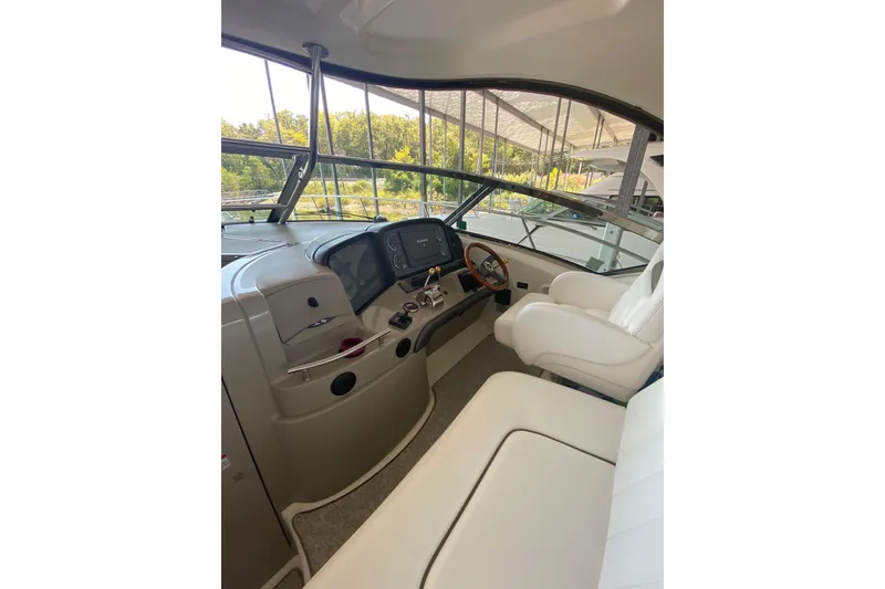 Slide: The Image of Interior view of 2006 Sea Ray 40 Sundancer yacht cockpit with white seating. - 18