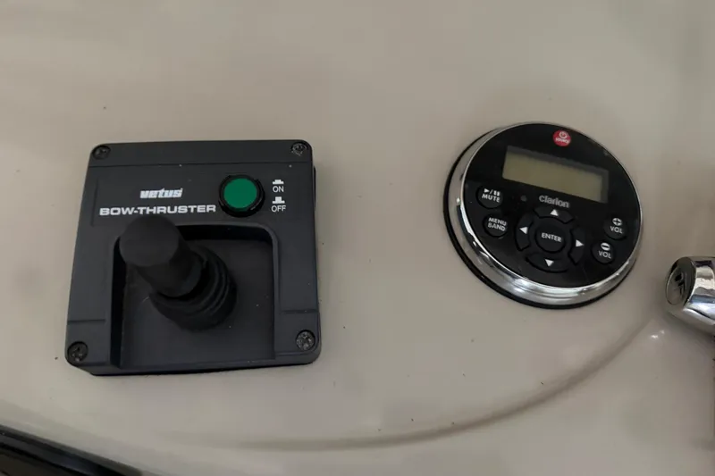 Slide: The Image of Control panel of 2006 Sea Ray 40 Sundancer with bow thruster and Clarion audio system. - 26