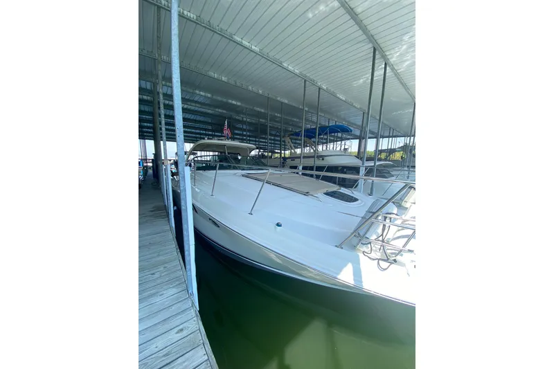 Slide: The Image of 2006 Sea Ray 40 Sundancer docked under covered marina. - 3